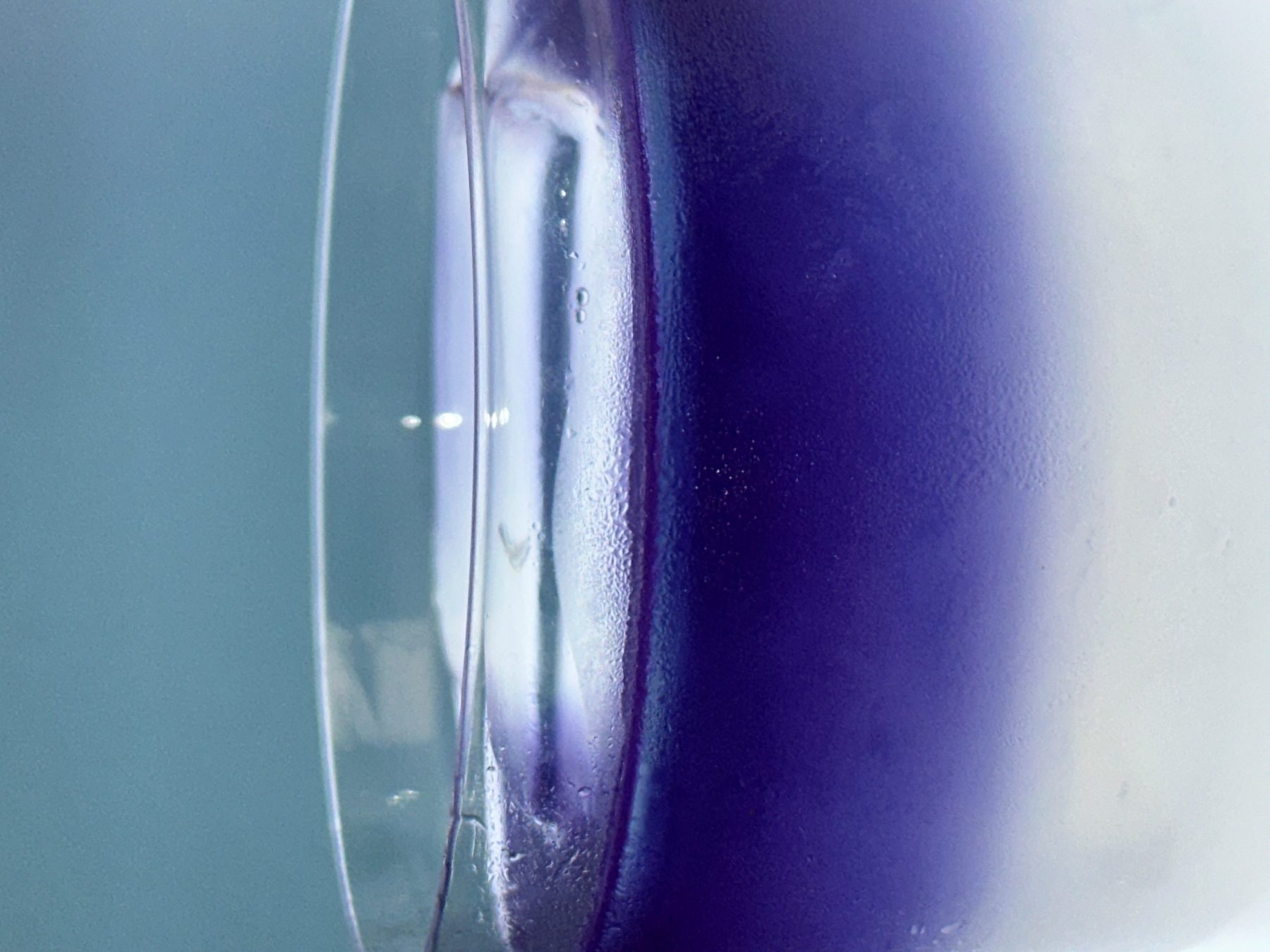 Macro close-up of glass condensation in soft lavender hues at Dissolved Solids